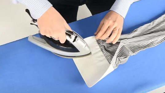 ironing a cuff of a shirt