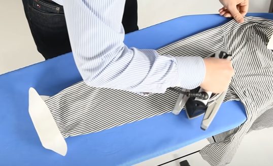 ironing sleeves of a shirt